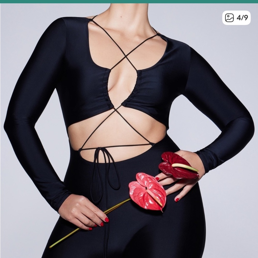 SKIMS Onyx Lace-Up Catsuit Onesie Bodysuit in Onyx.